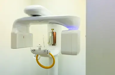 Dental patient receiving a scan of her mouth and jaws