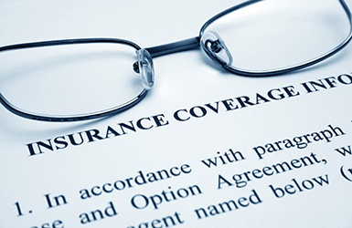 Glasses at the top of insurance coverage form