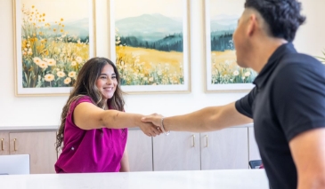 Person pulling a payment card out of their wallet