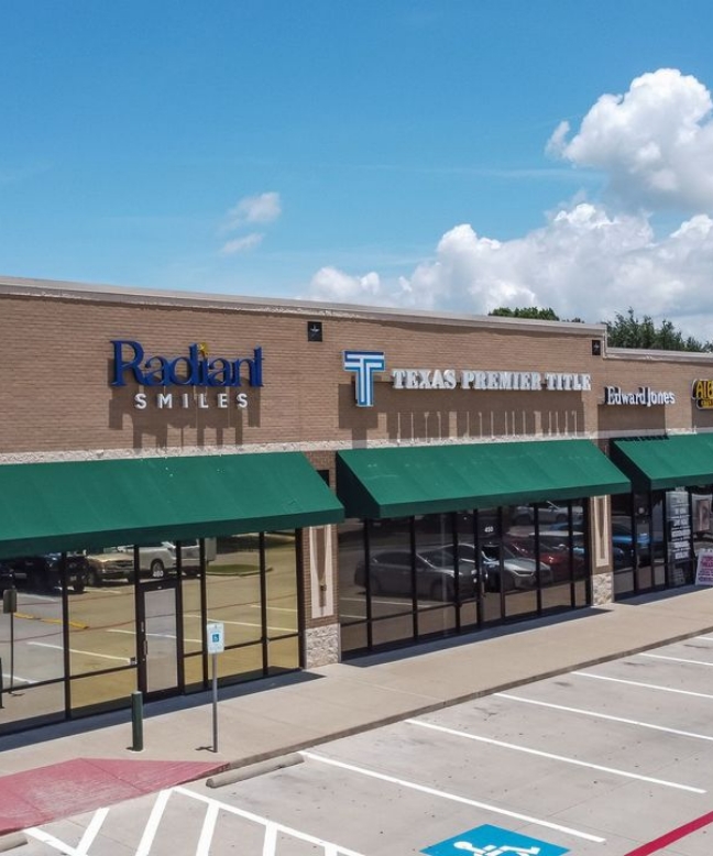 Exterior of light brown dental office in Grand Prairie