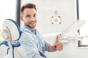 Man smiling after his cosmetic dental treatment