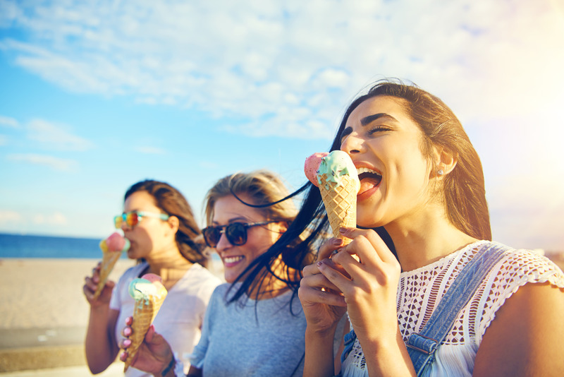 Patient eating ice cream with veneers